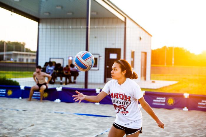 Student playing volleyball